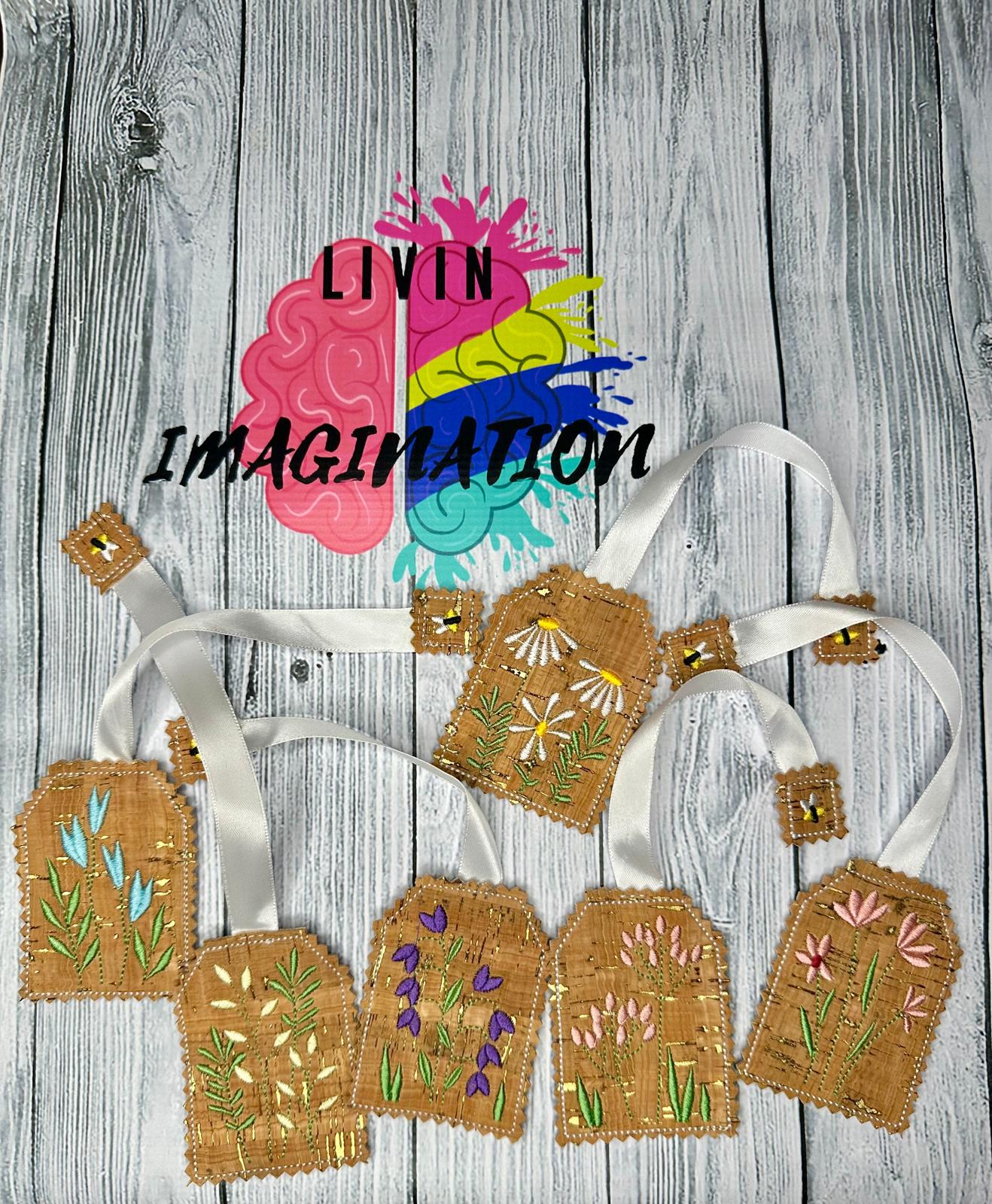 Decorative bookmarks with embroidered designs on cork fabric, featuring the brand various flowers.